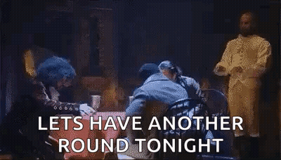 Men Standing Around Table Saying Let's Have Another Round Tonight GIF