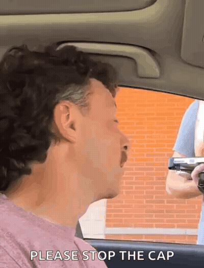 Men Standing Around Table With Arms Around Each Other GIF