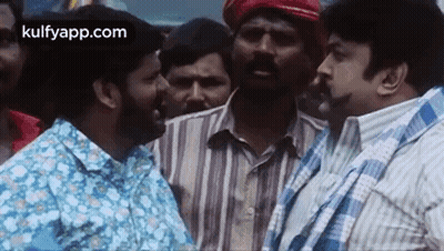 Men Standing In Crowd Talking GIF