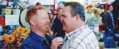 Men Standing In Crowded Market GIF