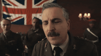 Men Standing In Dark Room With BBC GIF