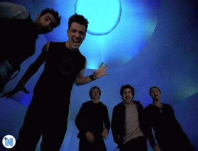 Men Standing In Front Of Blue Light With N GIF