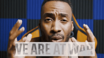 Men Standing In Front Of Building Savage Territory GIF