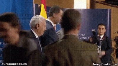 Men Standing In Front Of Europa Press.es Sign GIF