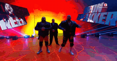 Men Standing In Front Of Kevin Mack Sign GIF
