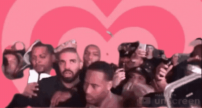 Men Standing In Front Of Pink Heart GIF