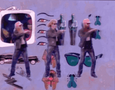 Men Standing In Front Of Television And Pyramid GIF