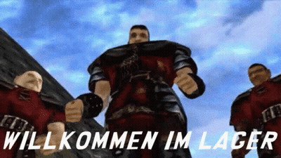 Men Standing In Front Of Willkommen Im Lager Sign GIF