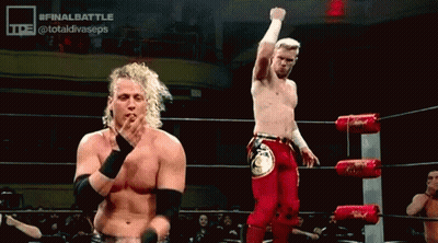 Men Standing In Wrestling Ring Fist Raised GIF