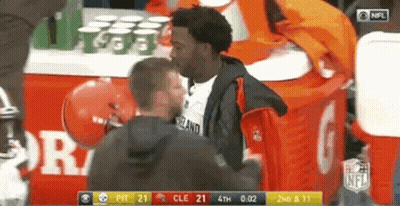 Men Standing Near NFL Table GIF