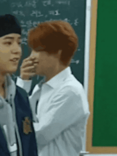 Men Standing Next To Each Other In Front Of Blackboard GIF
