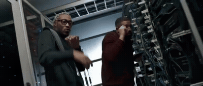 Men Standing Next To Each Other In Server Room GIF