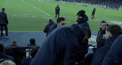 Men Standing On Soccer Field With EC Sign GIF