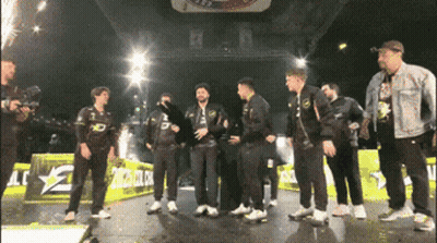 Men Standing On Stage With LG Sign GIF