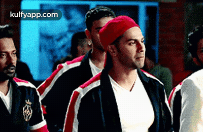 Men Standing Together In Room GIF