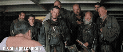 Men Surrounding Man Saying It's All Right Captain GIF