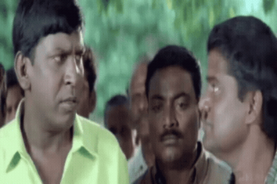 Men Talking In Crowd GIF