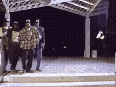 Men Under Gazebo One In Plaid Shirt GIF
