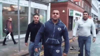 Men Walking Down Street With Open Every Day 8Am To 8Pm Sign GIF