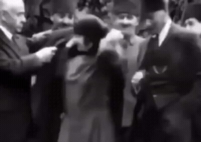 Men Walking In Front Of TRT 1 Screen GIF