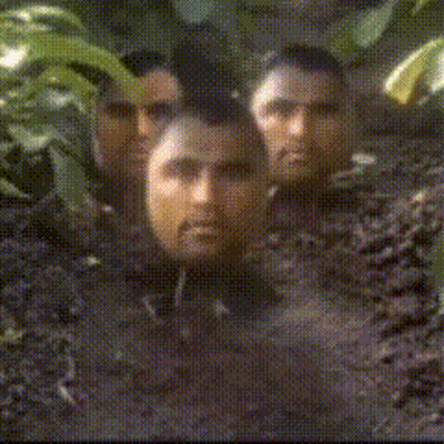 Men With Faces Covered In Dirt And Leaves GIF