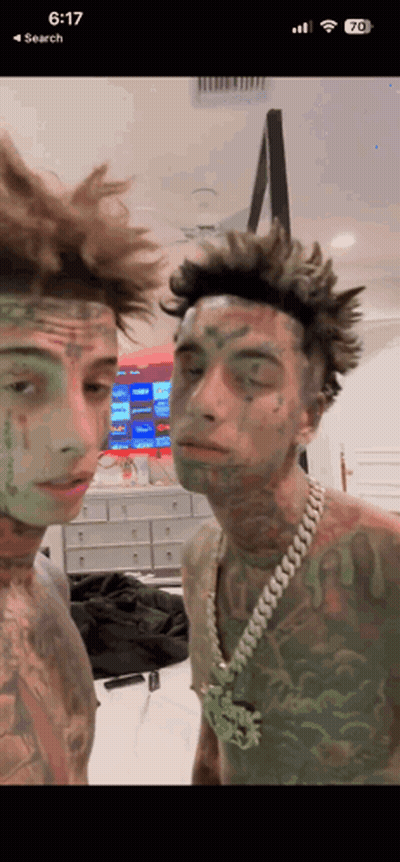 Men With Green Paint On Faces GIF