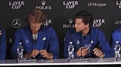 Men With Water Bottles At Table Saying Layer Cup GIF