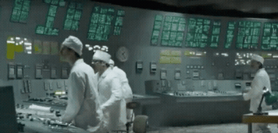Men Working In Control Room With Clock GIF