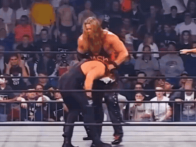 Men Wrestling In Ring In Front Of Crowd GIF