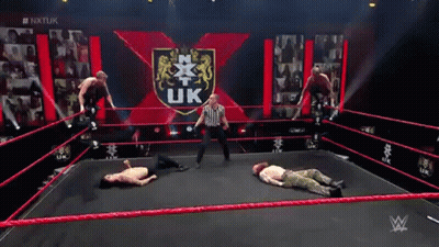 Men Wrestling In Ring With Referee GIF