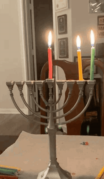 Menorah With Four Lit Candles GIF