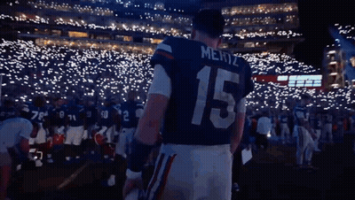 Mertz Football Player Standing Before Crowd GIF