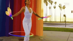 Mesmerizing Circus Juggling Hula Hoop Stunt GIF