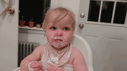 Messy Eating Toddler Licking Her Lips GIF