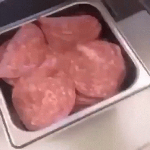 Metal Container With Sliced Meat GIF