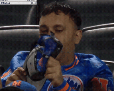 Mets Fan Adjusting Hat Watching Game GIF