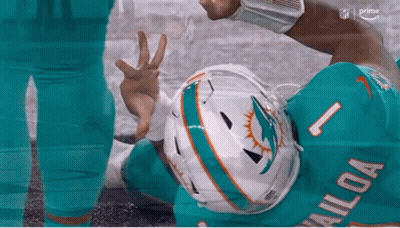 Miami Dolphins Player Giving Peace Sign On Ground GIF