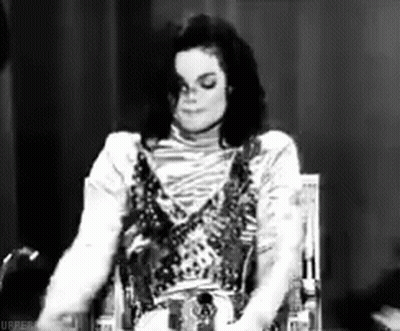 Michael Jackson Sitting In Chair Black And White Eyes Closed GIF