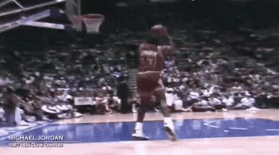 Michael Jordan Is Playing Basketball In Front Of A Crowd . GIF