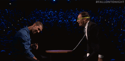Michael Phelps In A Table With Jimmy Fallon GIF