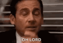 Michael Scott From The Office Is Making A Face With His Eyes Closed . GIF