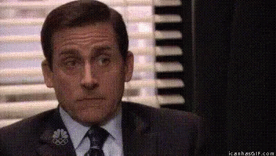 Michael Scott From The Office Is Wearing A Suit And Tie . GIF