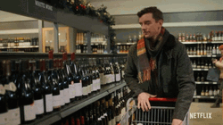 Michael Urie Buying Alcohol Bottle GIF