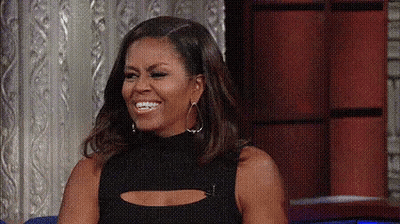 Michelle Obama Smiling On Couch GIF