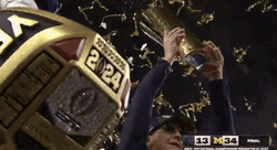 Michigan Wolverines Flexing Trophies GIF