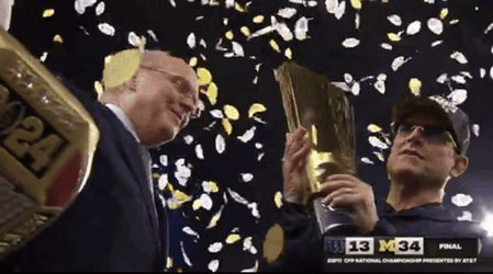 Michigan Wolverines Holding Trophies GIF