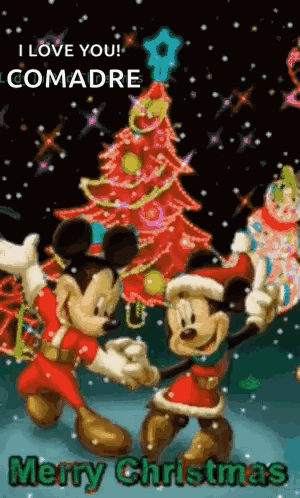 Mickey Mouse And Minnie Mouse Are Dancing In Front Of A Christmas Tree GIF