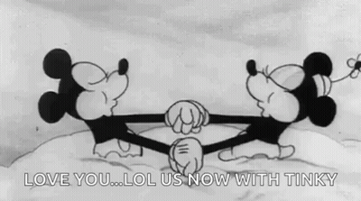 Mickey Mouse And Minnie Mouse Kissing In Snow GIF