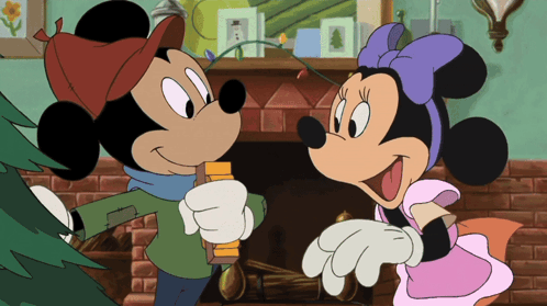Mickey Mouse And Minnie Mouse Standing Next To Each Other GIF