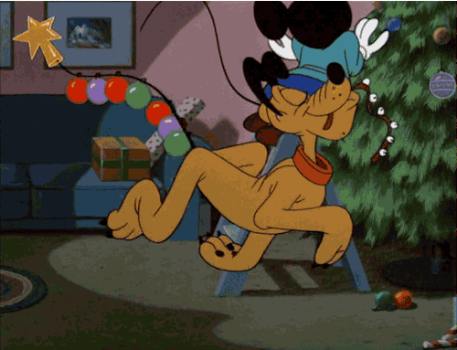 Mickey Mouse And Pluto Are Decorating A Christmas Tree With A Star GIF